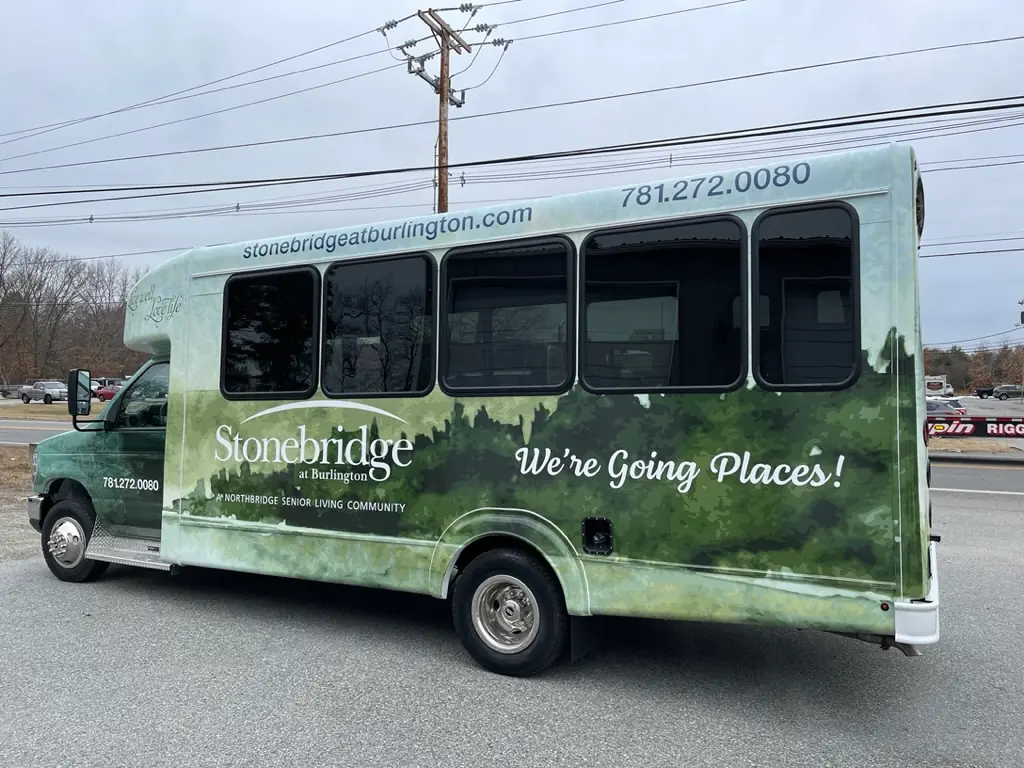 a senior living facility bus is wrapped using large format printing services